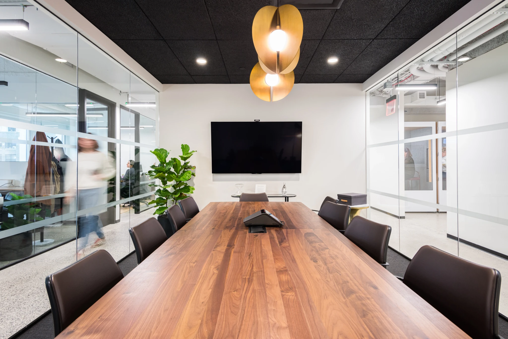 a large, bright meeting room with a large screen