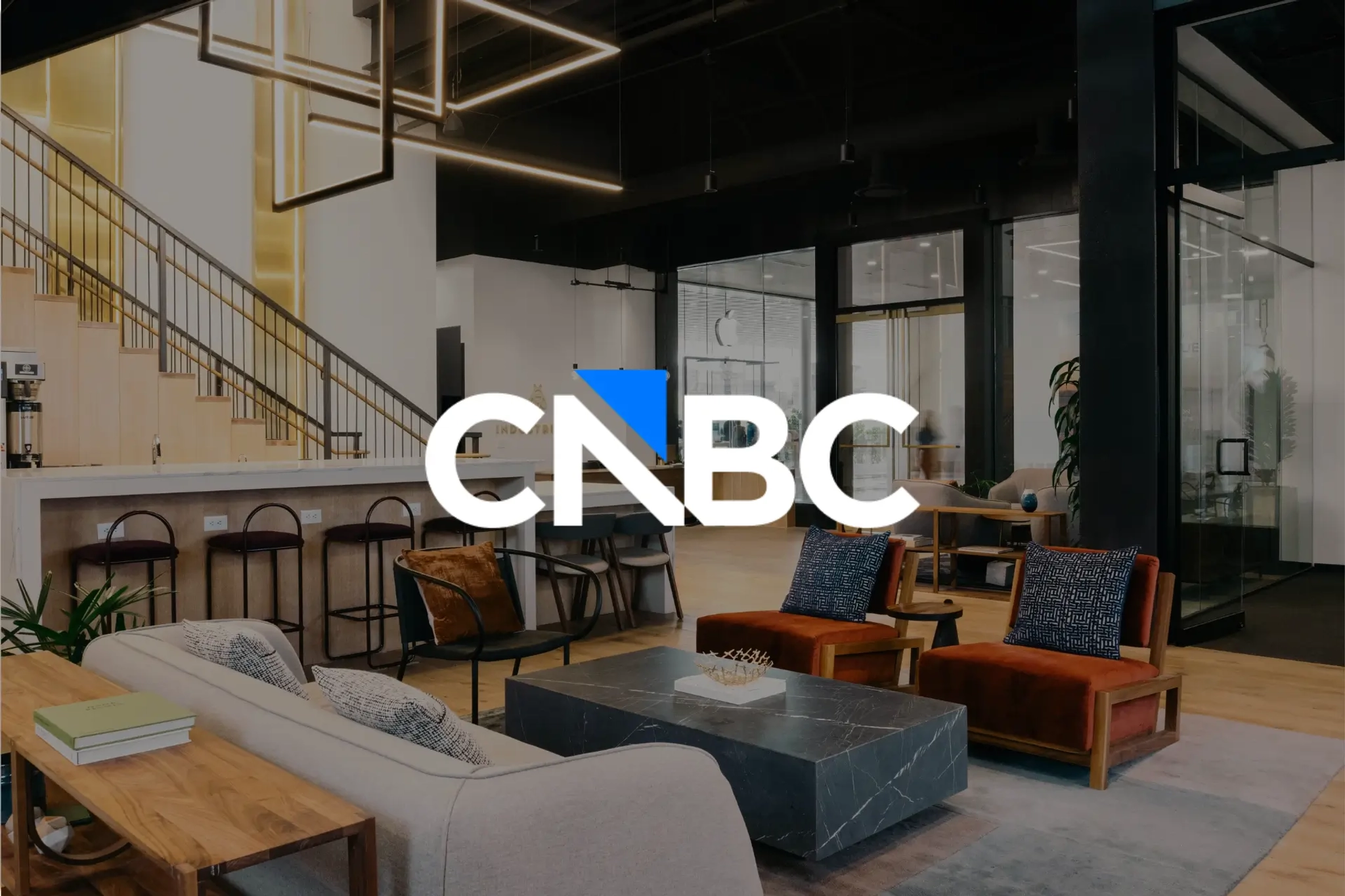 CNBC logo with Industrious office space in the background